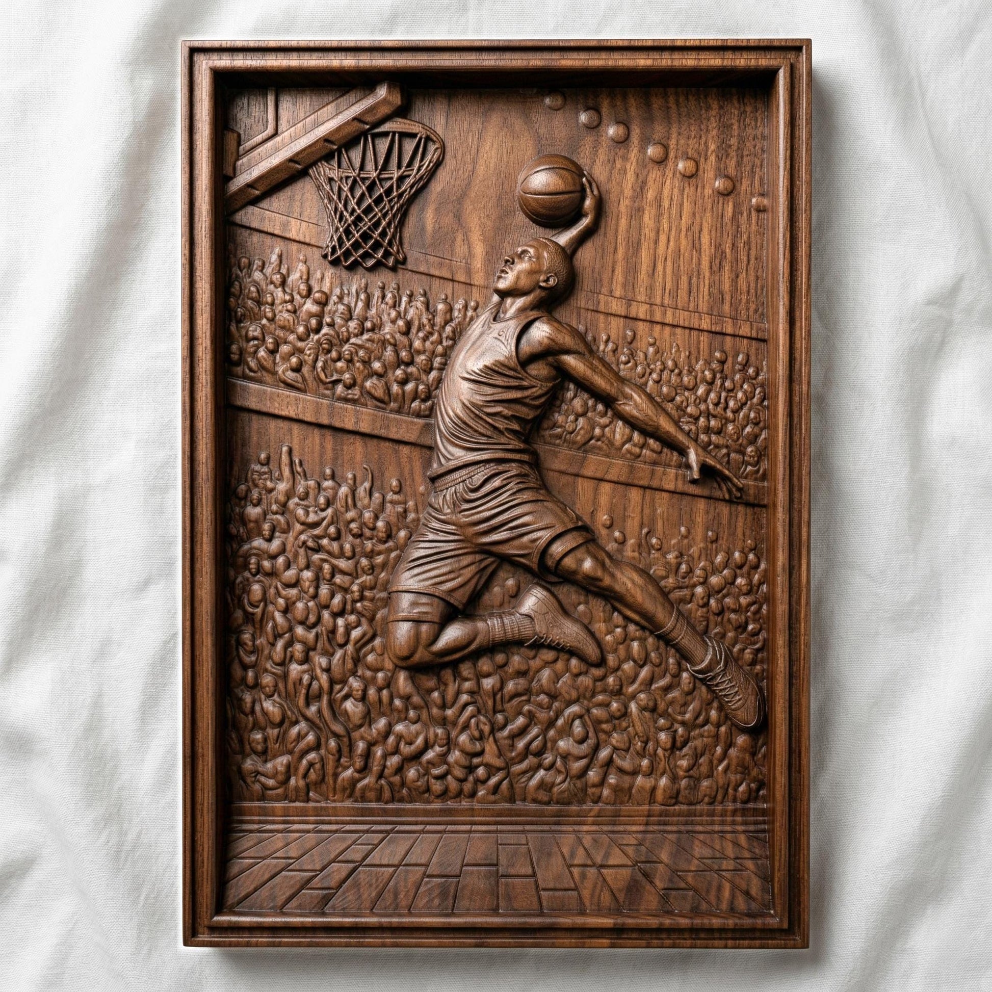 Dynamic bas-relief carving of a basketball player soaring mid-air for a powerful dunk, surrounded by a packed arena crowd, detailed court flooring, and hoop with net, capturing motion, athletic energy, and depth in a bold sports-themed composition.