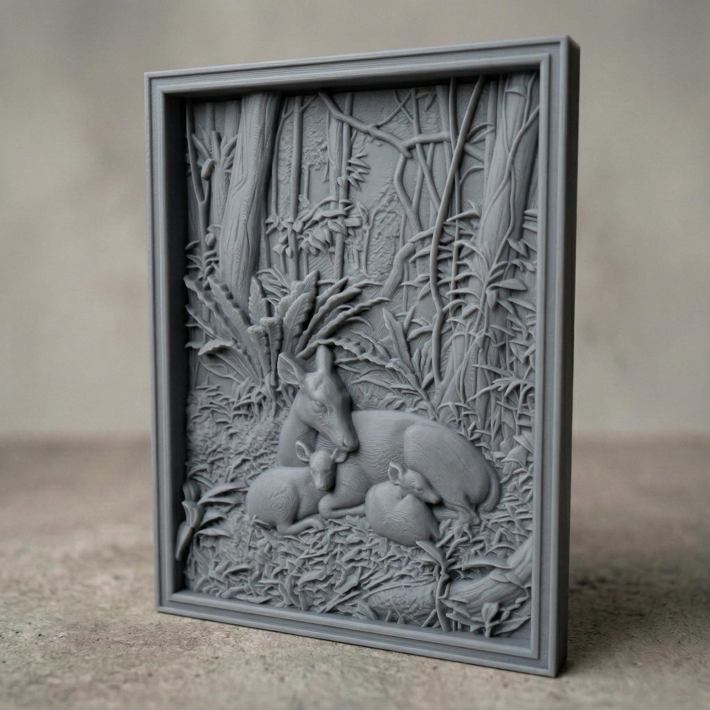 Detailed bas-relief carving of a deer resting peacefully with two fawns nestled beside it in a dense forest setting, surrounded by lush foliage, textured leaves, and tall trees, capturing warmth, protection, and tranquility in a natural woodland scene.