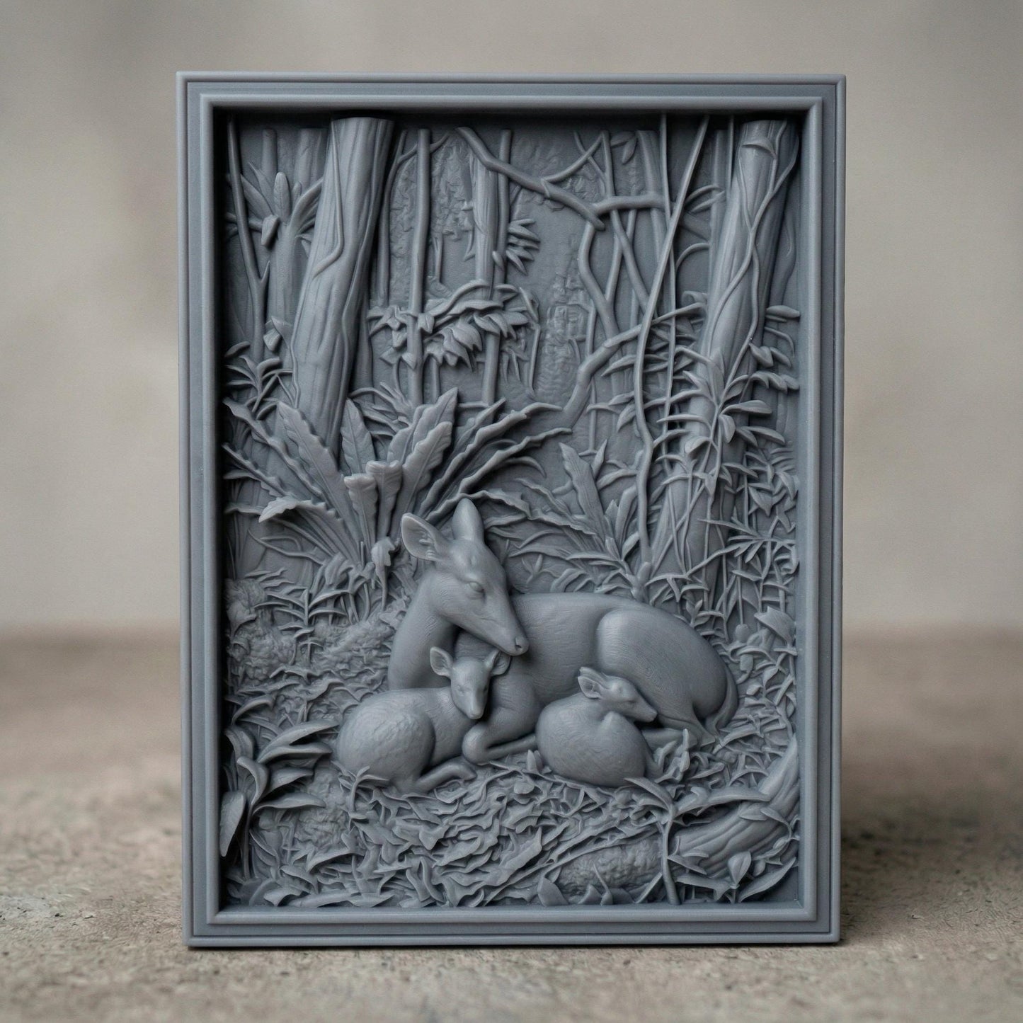 Detailed bas-relief carving of a deer resting peacefully with two fawns nestled beside it in a dense forest setting, surrounded by lush foliage, textured leaves, and tall trees, capturing warmth, protection, and tranquility in a natural woodland scene.
