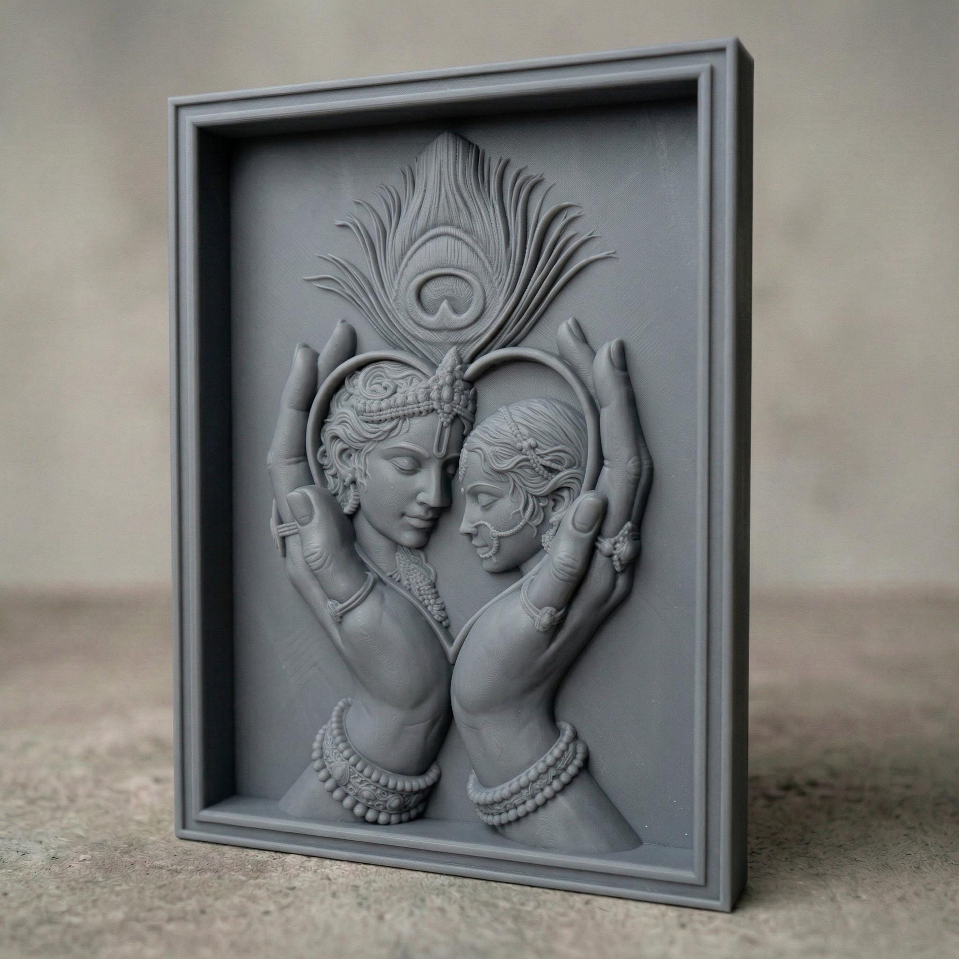Intricately carved bas-relief of Radha and Krishna in an intimate embrace, framed by graceful hands forming a heart shape. A detailed peacock feather rises above, symbolizing divine love and harmony. Ornate jewelry, flowing hair, and smooth wood grain textures enhance the spiritual and romantic essence of this elegant composition.