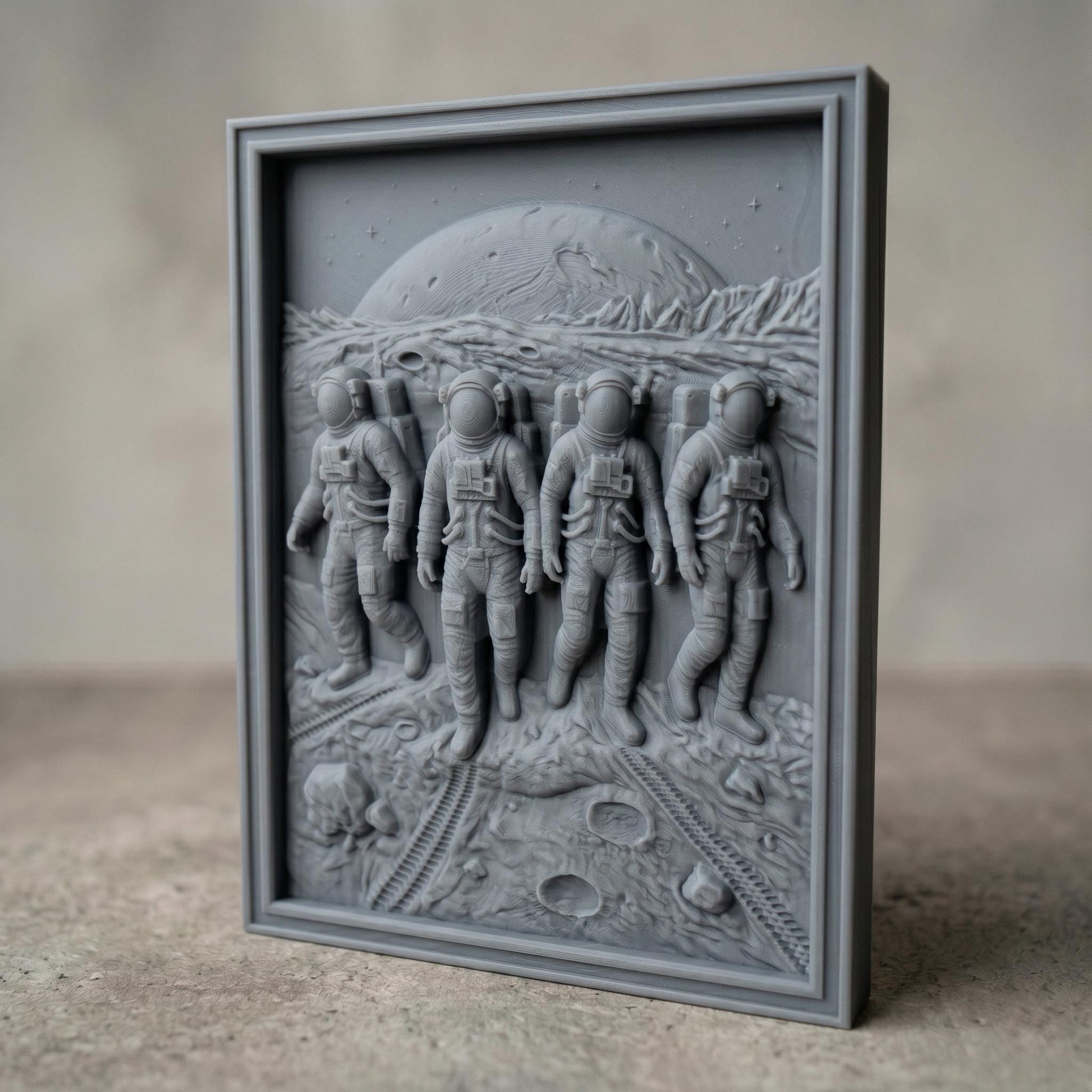 Detailed bas-relief carving of four astronauts walking across a lunar surface with visible craters and rover tracks, set against a large planetary horizon and rugged terrain, framed in a rectangular wooden panel. The figures wear full space suits with helmets and backpacks, captured in motion with realistic depth and texture, evoking space exploration and teamwork.