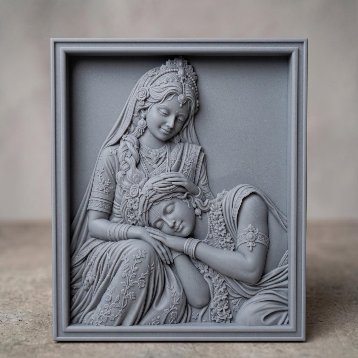 Radha Krishna bas-relief sculpture showing Radha seated, gently cradling Krishna's sleeping head in her hands. Both figures wear ornate carved jewelry, tiaras, bangles, and floral garlands, with a peacock feather motif in Krishna's headdress. Rich wood grain texture and fine raised detail fill the piece, framed by a rectangular carved border. Designed for CNC relief carving, wood routing, resin casting, and 3D printing as devotional wall decor.