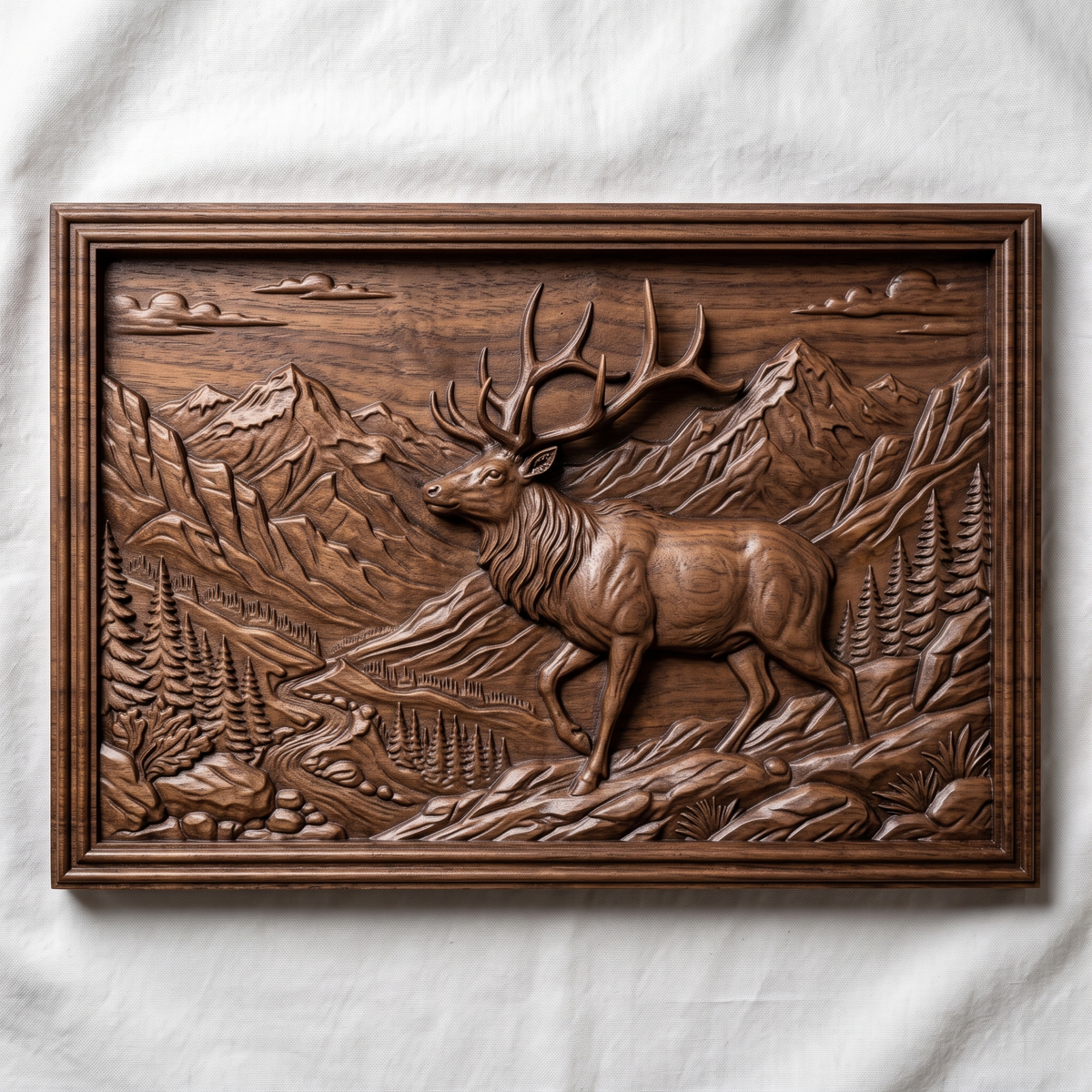 Detailed 3D bas-relief of a bull elk walking through a mountain valley with towering peaks, pine forest, winding river, clouds and rocky foreground. Set in a landscape rectangular panel with a stepped molded frame, shown in carved walnut wood. Designed for CNC relief carving, woodworking and 3D printing as rustic wildlife wall decor.