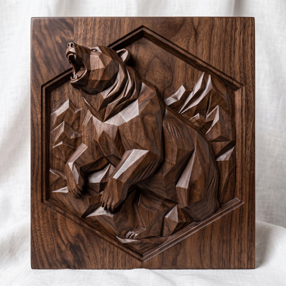 Geometric low poly 3D bas-relief of a roaring bear rearing up with raised front paws, faceted fur and angular mountain peaks. Set inside a recessed hexagon panel on a flat square slab. Shown in carved walnut wood and grey resin. Designed for CNC relief carving, woodworking and 3D printing as modern wildlife and cabin wall decor.