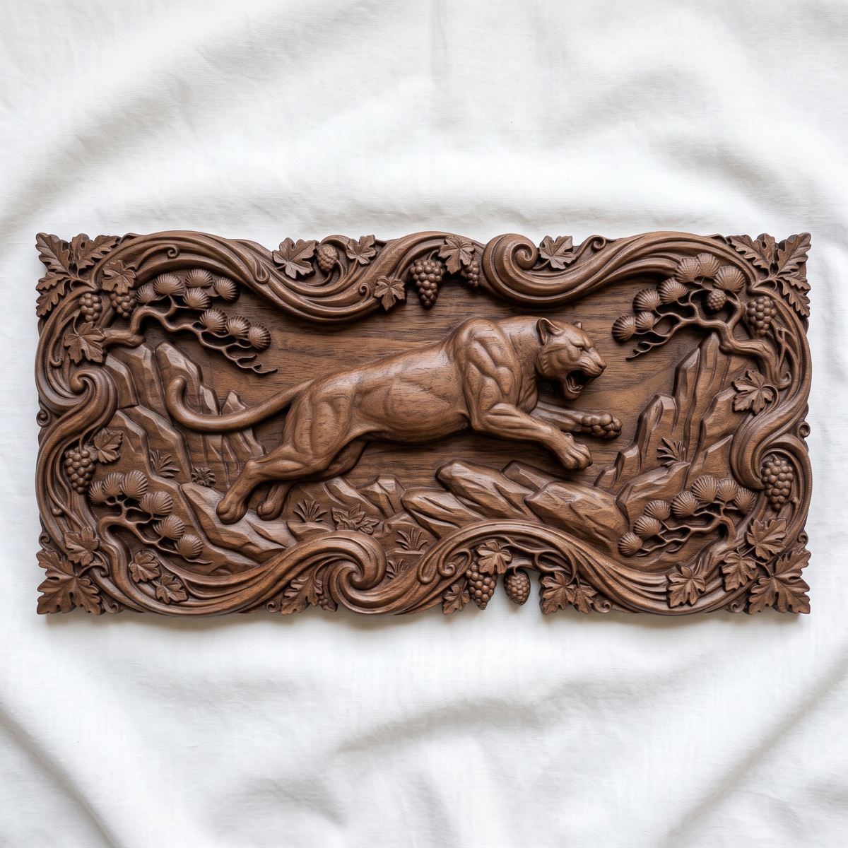 Leaping mountain lion carved in dark walnut wood as a cutout with a scrolling vine, grape and pine branch border and leaf corners, shown as a workshop mockup and a grey resin render. Digital STL relief file for CNC routers and 3D printers, ideal for wildlife wall art, panels and woodworking projects.