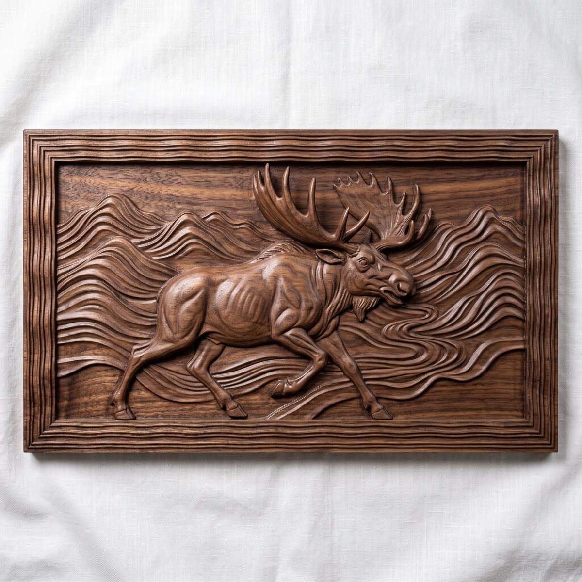 High-relief 3D bas-relief of a running moose with huge antlers striding through flowing wave-pattern mountains beside a winding river, set in a wide landscape rectangular plaque with a wavy stepped molded border. Fine fur, muscle and layered ridge detail. Designed for CNC relief carving, wood routing and 3D printing as rustic wildlife wall decor for a cabin, lodge or den.