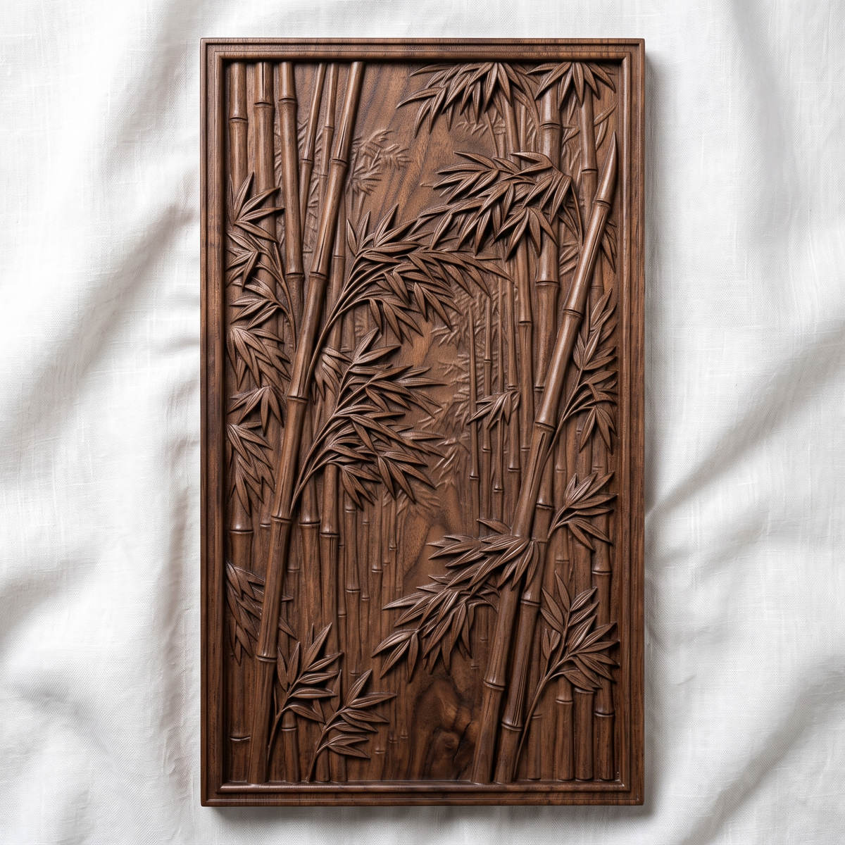 Highly detailed 3D bas-relief of a dense bamboo grove, with tall jointed stalks and layered leaf clusters receding into a misty forest path, framed by a raised molded border. Fine relief carving captures individual leaf veins, stalk nodes, and natural wood grain throughout the panel. Designed for CNC relief carving, wood routing, and 3D printing as zen garden, Asian-inspired, or botanical wall decor.