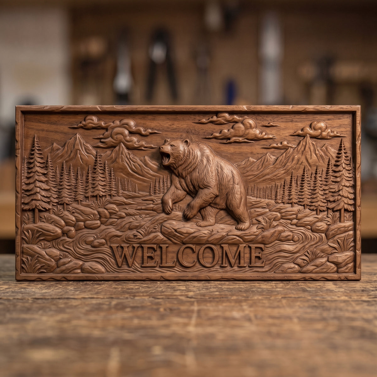 Detailed 3D bas-relief of a roaring grizzly bear standing on its hind legs in a mountain valley, with WELCOME lettering carved below. Pine forest, rocky stream, rugged peaks and billowing clouds fill the scene on a rectangular slab with a rough stone-style edge. Fine fur texture. Designed for CNC relief carving, woodworking and 3D printing as rustic cabin and porch wall decor.