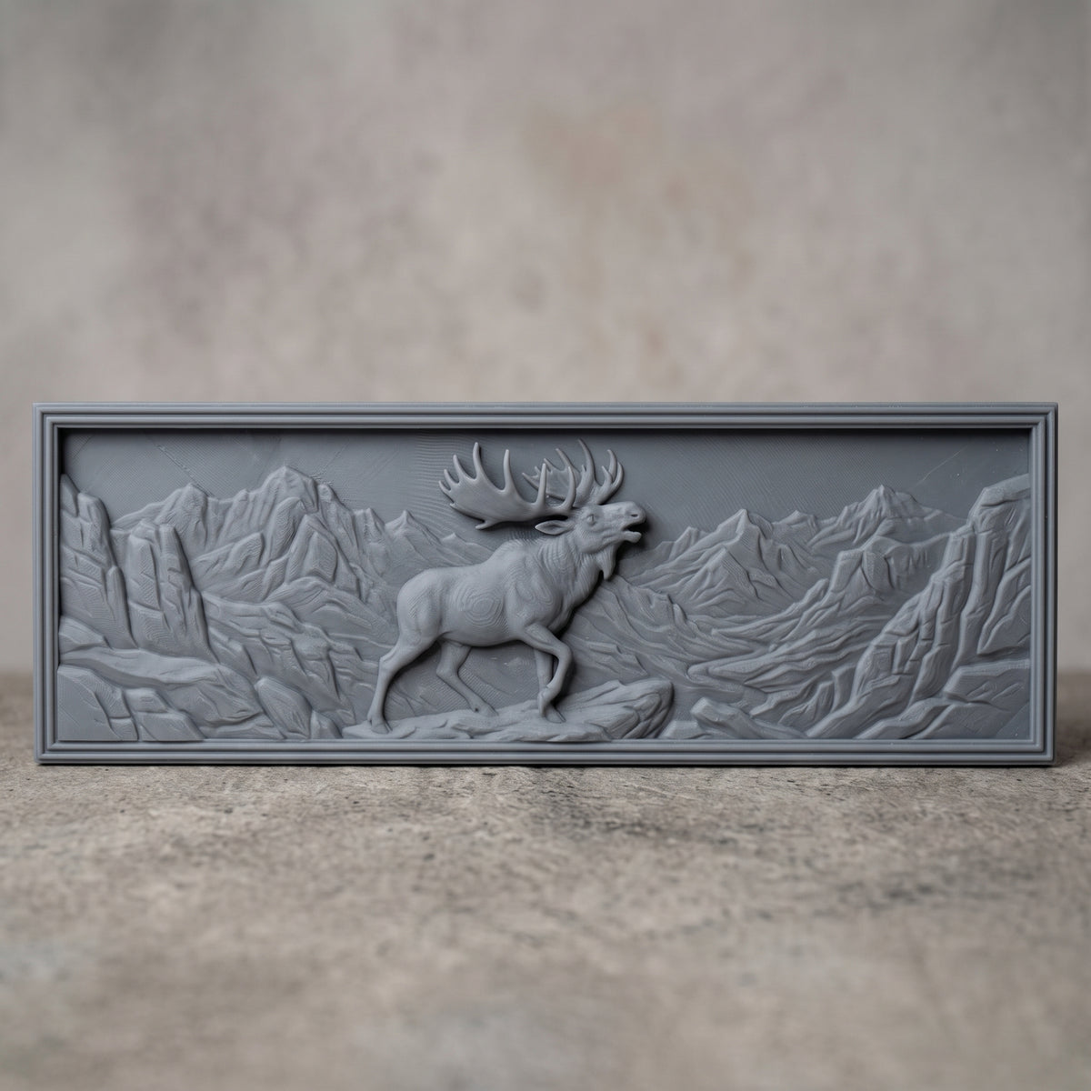 High-relief 3D bas-relief of a bugling moose with large palmate antlers standing on a rocky ledge in a rugged mountain valley with a winding river, set in a wide landscape rectangular plaque with a stepped molded border. Fine fur, rock and peak detail with layered relief. Designed for CNC relief carving, wood routing and 3D printing as rustic wildlife wall decor for a cabin, lodge or hunting den.