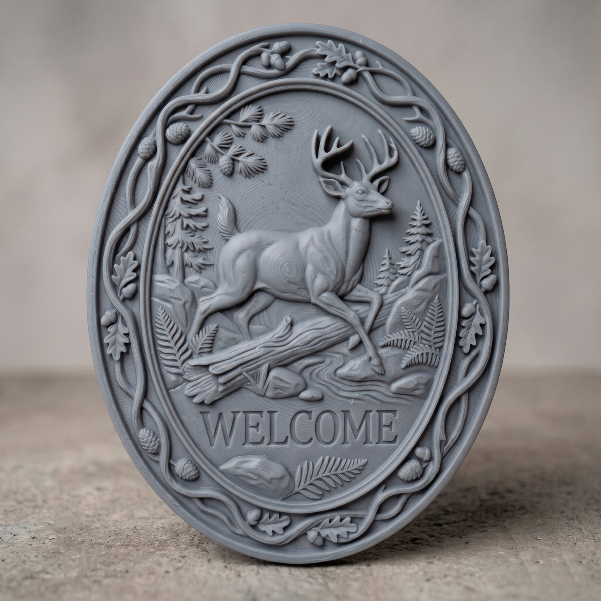 3D bas-relief welcome sign of a leaping buck with a full set of antlers, set in an oval frame with a raised vine border. Oak leaves, acorns, pine cones, ferns, rocks, a fallen log and a stream surround the deer, with carved WELCOME lettering below. Smooth sculpted anatomy and fine leaf detail. Designed for CNC relief carving, woodworking and 3D printing as oval wall decor.