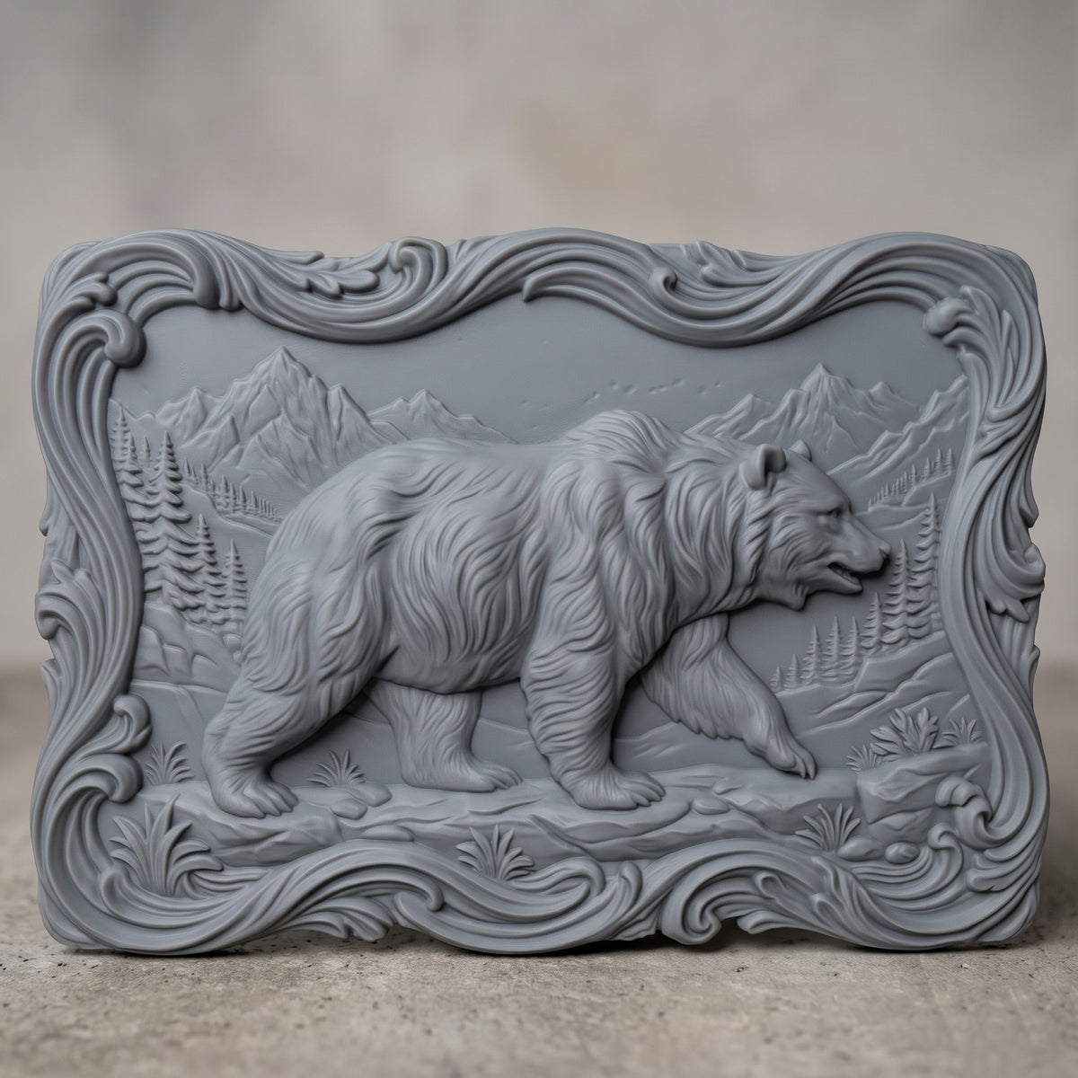 Detailed 3D bas-relief of a walking grizzly bear in side profile with thick shaggy fur, one front paw raised, set in a mountain valley with pine trees, grass tufts and rocks. Framed by an ornate wavy scrollwork border with a flowing irregular edge. Shown in carved walnut wood and grey resin. Designed for CNC relief carving, woodworking and 3D printing as rustic cabin wildlife wall decor.
