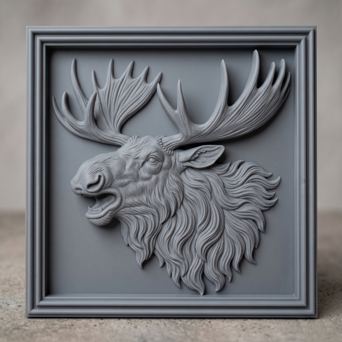 High-relief 3D bas-relief of a bugling moose head with open mouth, huge palmate antlers and a flowing shaggy mane, set in a square framed plaque with a stepped molded border and flat recessed background. Fine fur and antler grain detail with layered relief. Designed for CNC relief carving, wood routing and 3D printing as rustic wildlife wall decor for a cabin, lodge or hunting den.