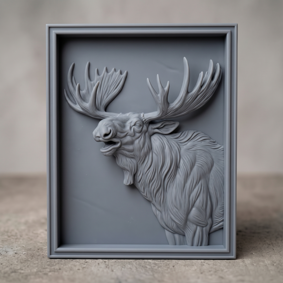 High-relief 3D bas-relief of a bellowing bull moose bust with wide palmate antlers and a shaggy mane, set in a stepped rectangular frame. Fine fur, muscle and antler detail rising from a smooth recessed background. Designed for CNC relief carving, wood routing and 3D printing as rustic wildlife wall decor for a cabin, lodge or hunting den.
